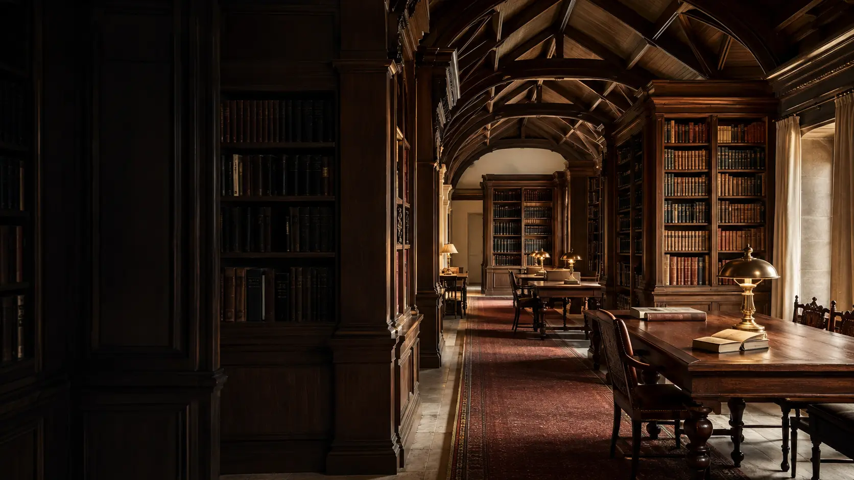 A quiet, dark-oak research library with an oxblood runner and brass reading lamps